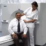 Patient/Technologist by CT scanner