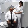 Patient/Technologist by CT scanner