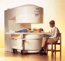 A mother sits while her daughter undergoes an "open" MRI scan