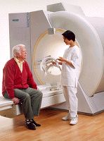 A technologist discusses an MRI with a patient