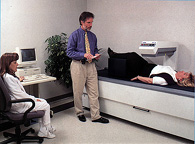 A person undergoing a DEXA bone scan